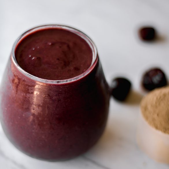 a glass full of beet cherry chocolate smoothie