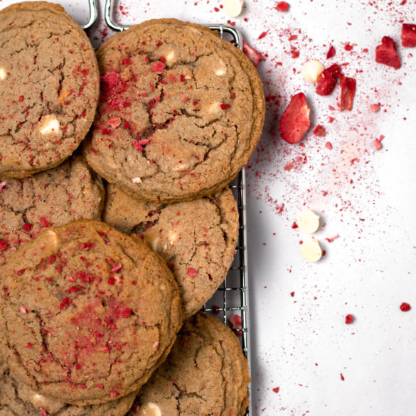 strawberry cookies sprinkled with strawberries and white chocolate chips