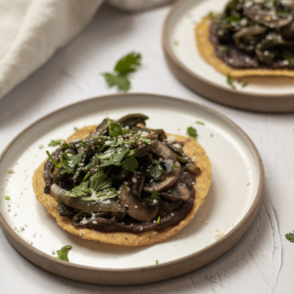 a couple of poblano mushroom tostadas ready to eat