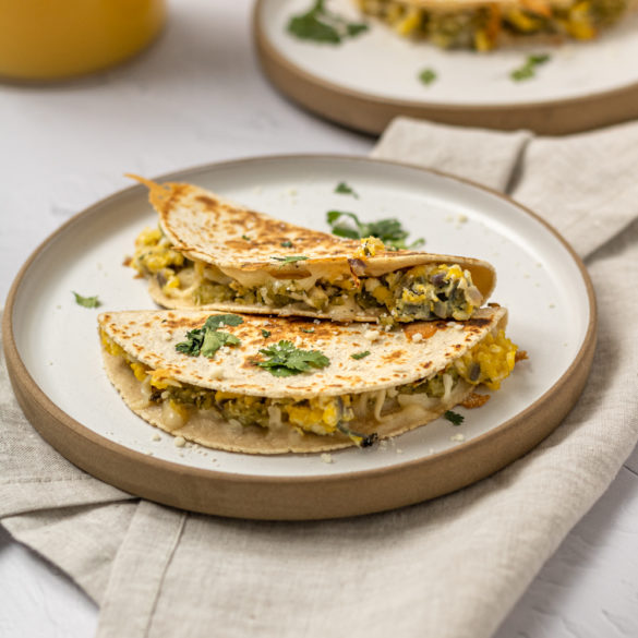 a plate of breakfast quesadillas waiting to be eaten