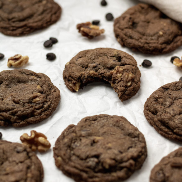 a stolen bite out of a chocolate walnut cookie