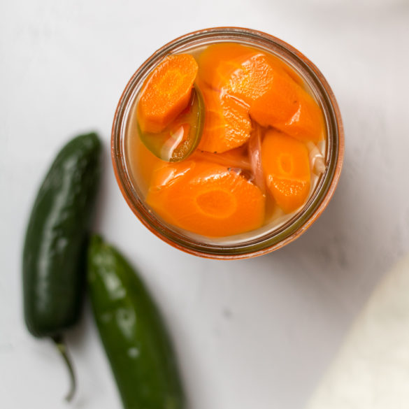 a jar of spicy carrots ready to eat