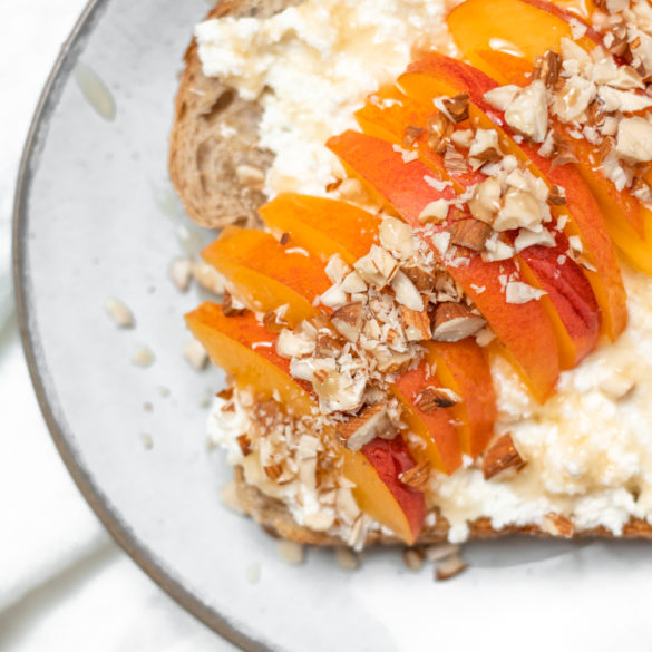 a close up of the nectarine and ricotta toast