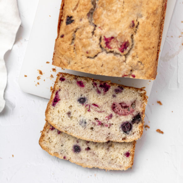 beginning to slice a triple berry loaf